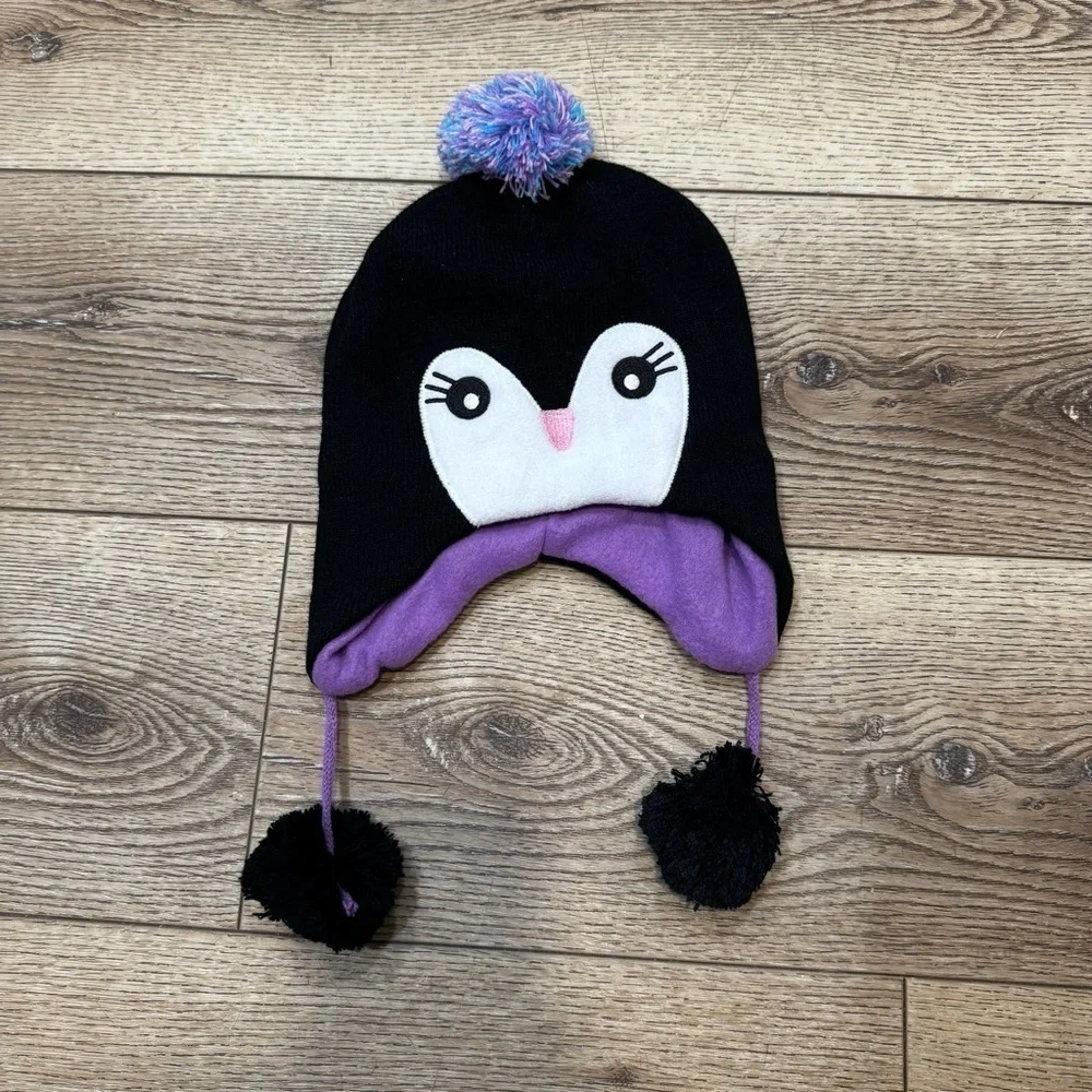 Penguin snow hat, black with white & purple, tassles, purple lining, stretchy.